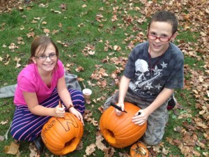 Students carving pumpkins at MMS